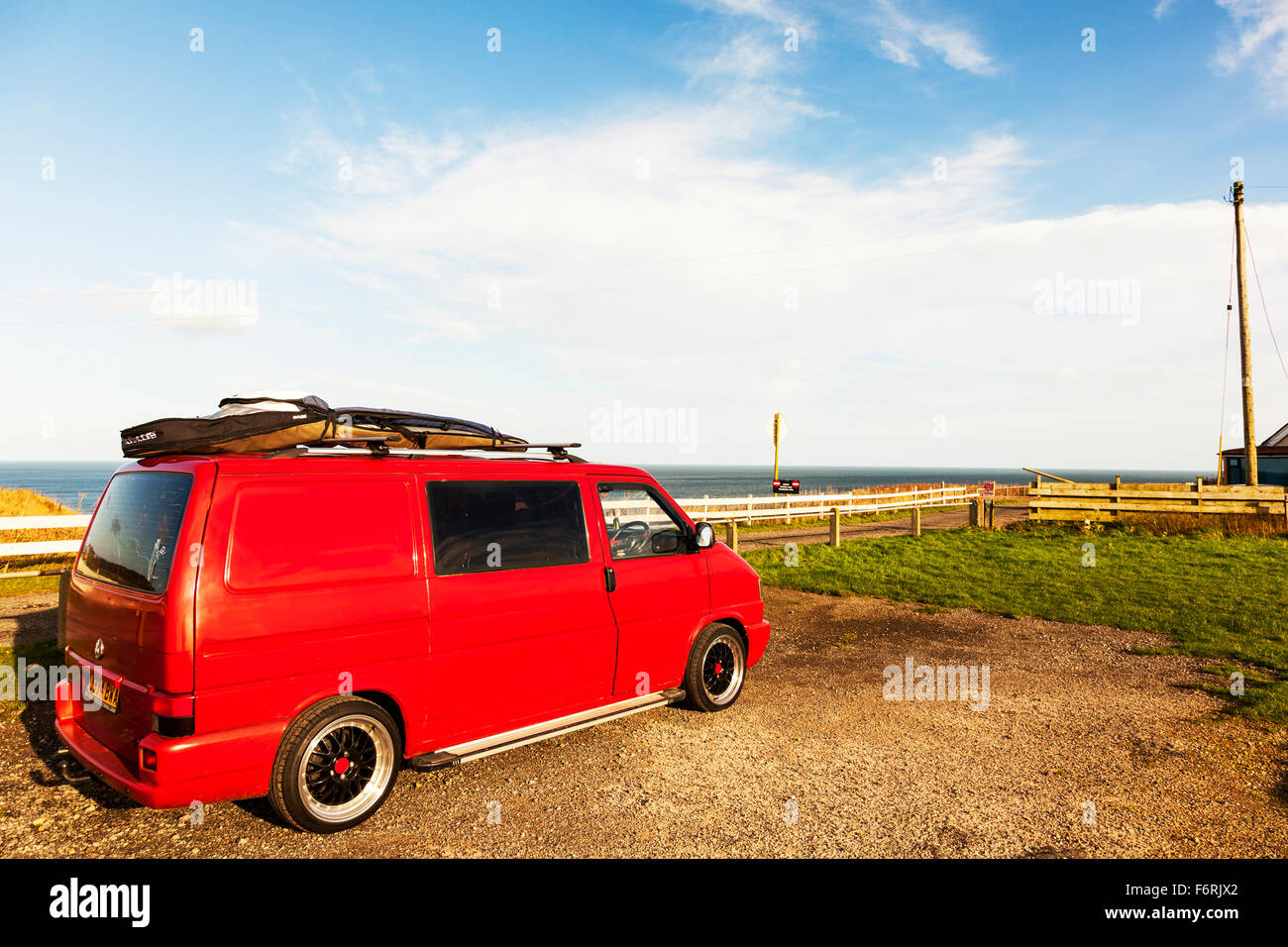 VW Volkswagen camper van T2 surfer surf boards on top at coast parked  Cayton Bay Yorkshire UK England vans Stock Photo - Alamy