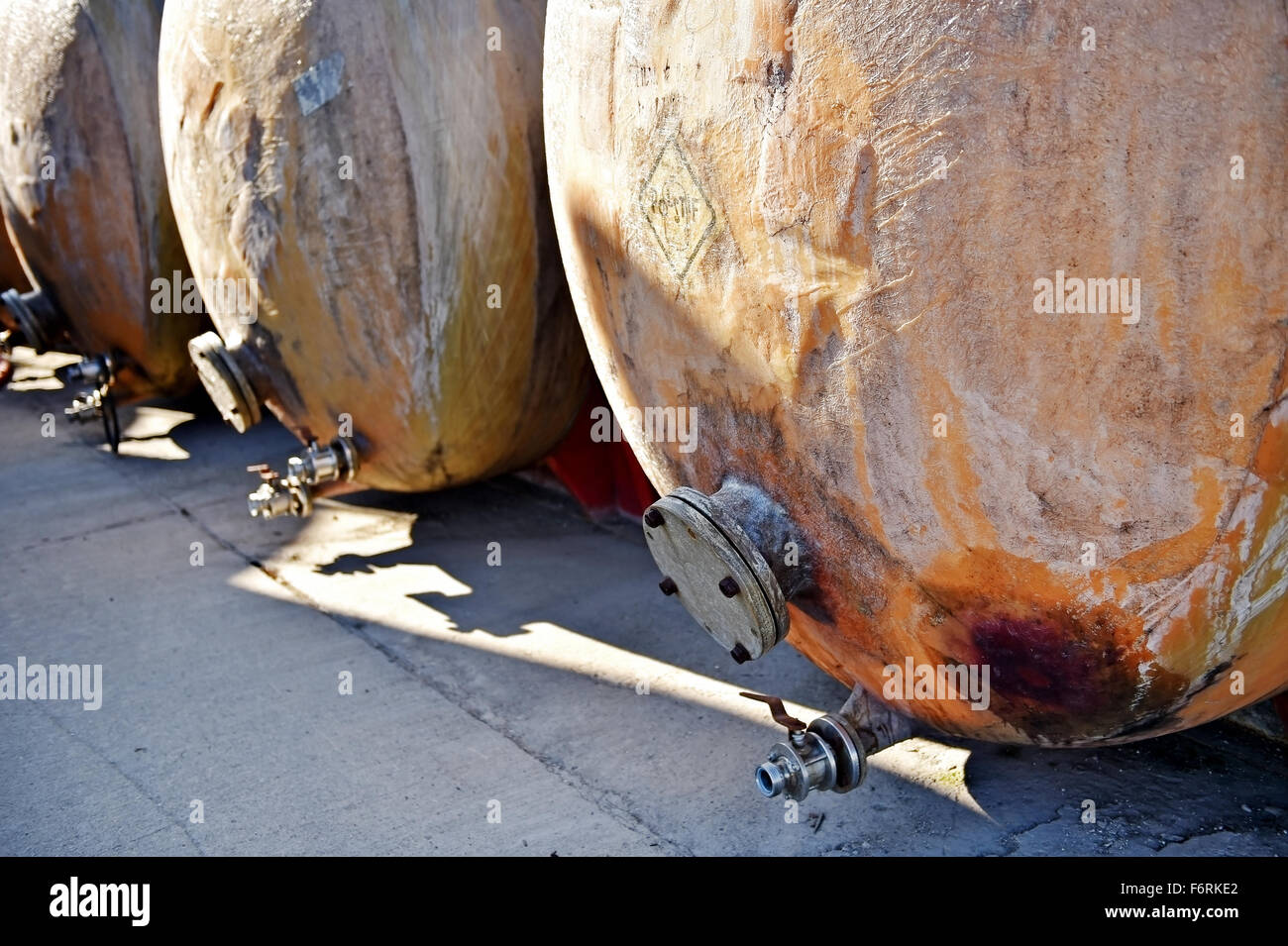 Industrial detail with big fiber glass tanks for wine storage Stock Photo