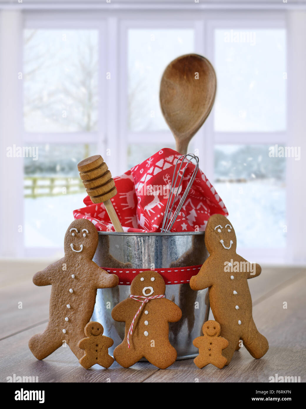 Freshly baked gingerbread cookies with baking utensils for Christmas Stock Photo