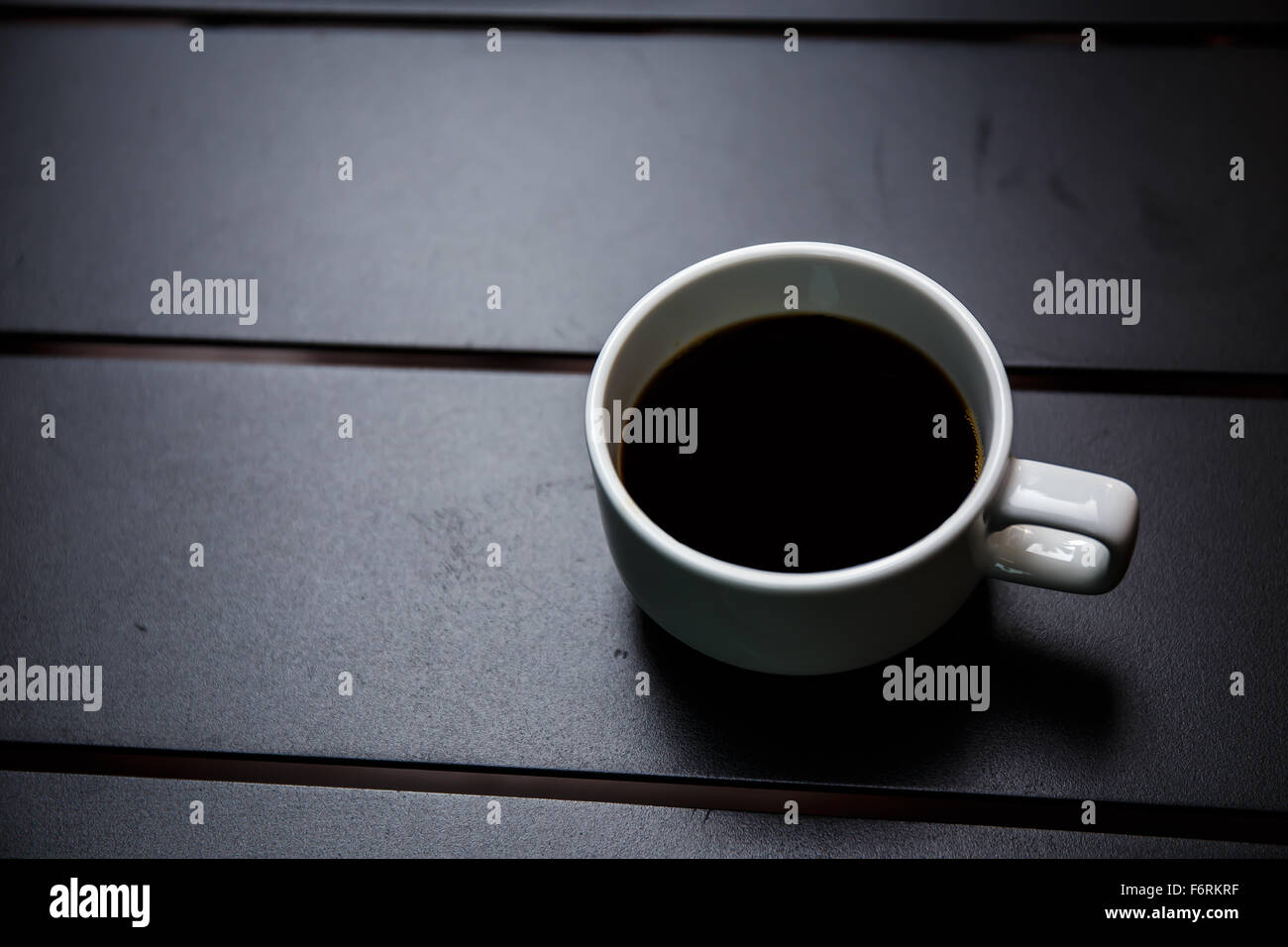 coffee cup on black table Stock Photo