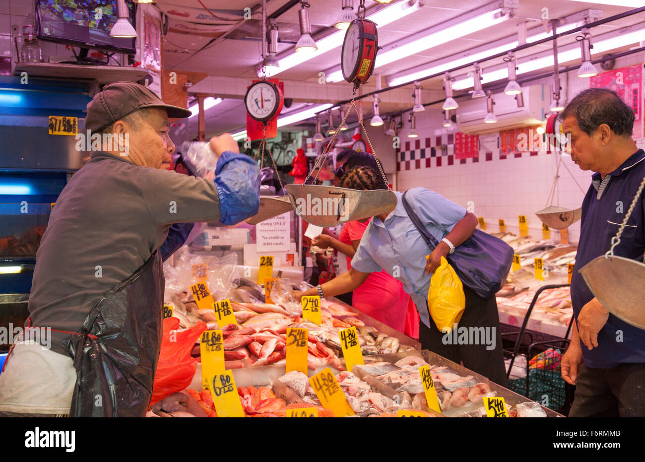 Fresh fish market in Chinatown New York City Manhattan selling fish to