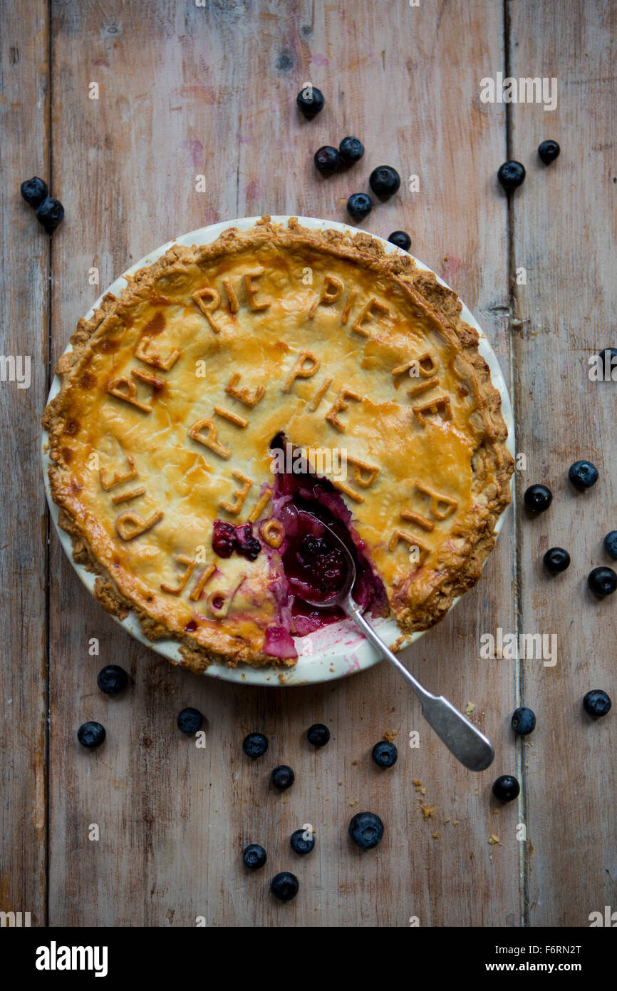 Fruit Pie with Slice Removed & Spoon Stock Photo