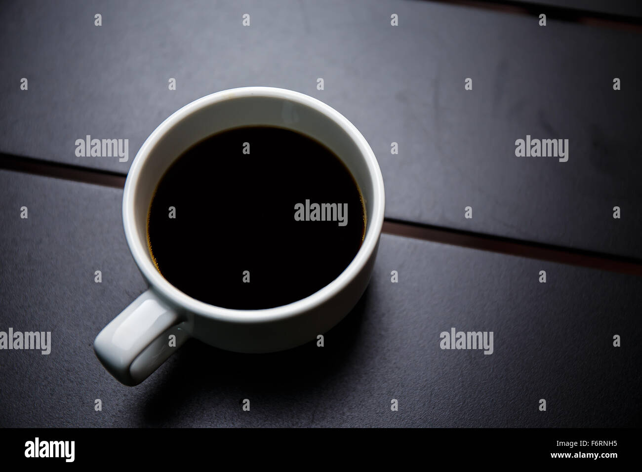 coffee cup on black table Stock Photo