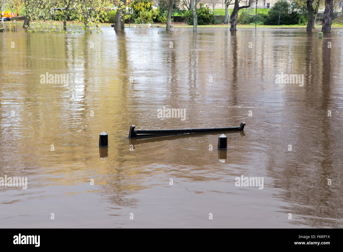 York, UK. 19th Nov, 2015. The top of a bench just visible above the River Ouse in York city centre, where footpaths have been flooded by the rising water level. Credit:  James Copeland/Alamy Live News Stock Photo
