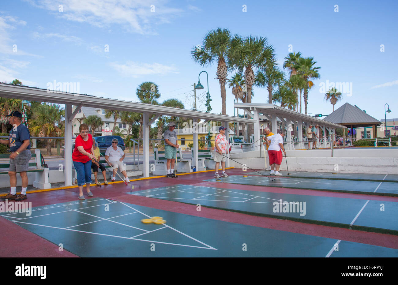 Senior Citizens Playing Competitive Shuffleboard Game In Flager Ave In
