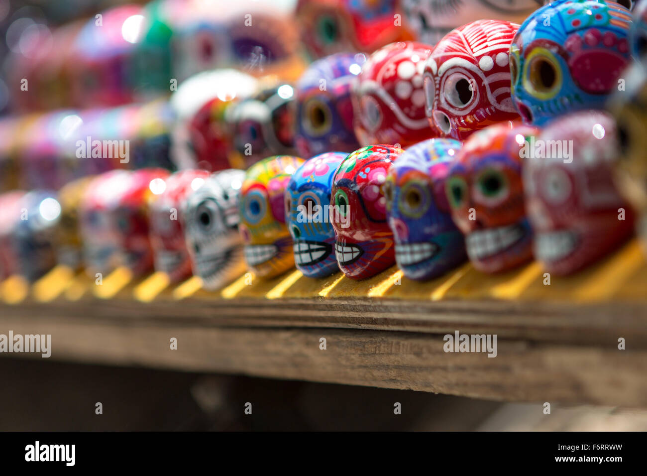 Day of the dead themed souvenirs for sale at market stall at Chichen Itza, Mexico Stock Photo
