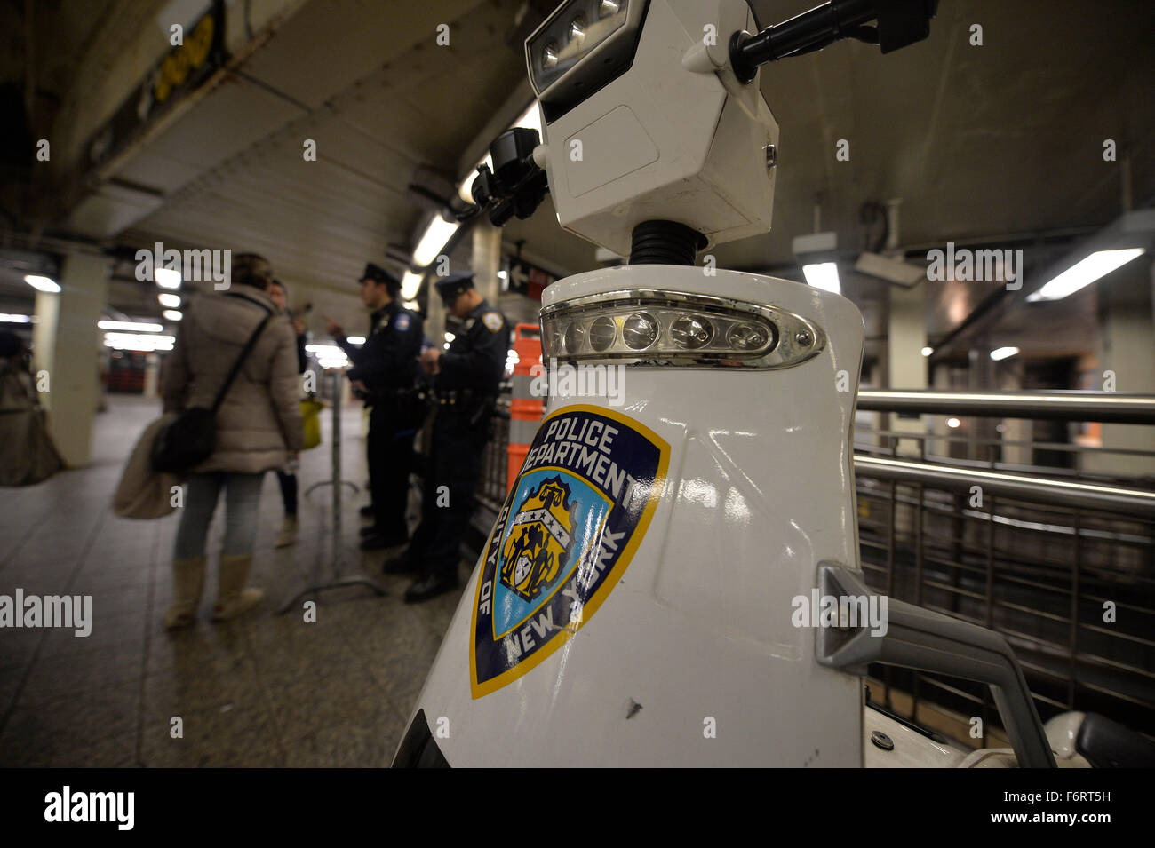 New York, USA. 19th Nov, 2015. Police officers stand guard at a subway ...