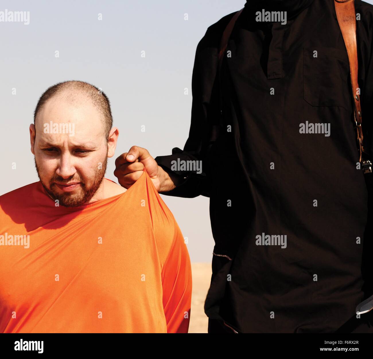 Islamic State of Iraq and the Levant propaganda photo showing the execution of American journalist Steven Sotloff by masked ISIS militant Jihadi John in September 2014. Stock Photo