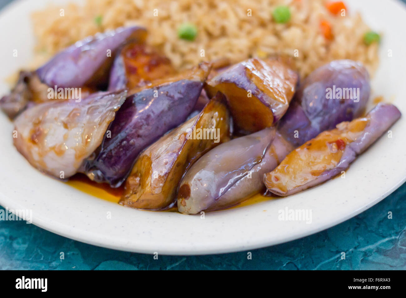 Chinese sauteed eggplant with oyster sauce and fried rice Stock Photo