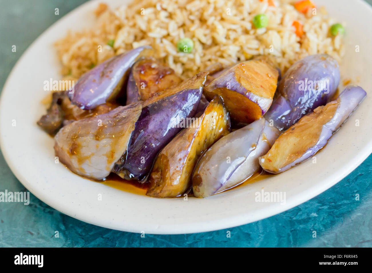 Chinese sauteed eggplant with oyster sauce and fried rice Stock Photo