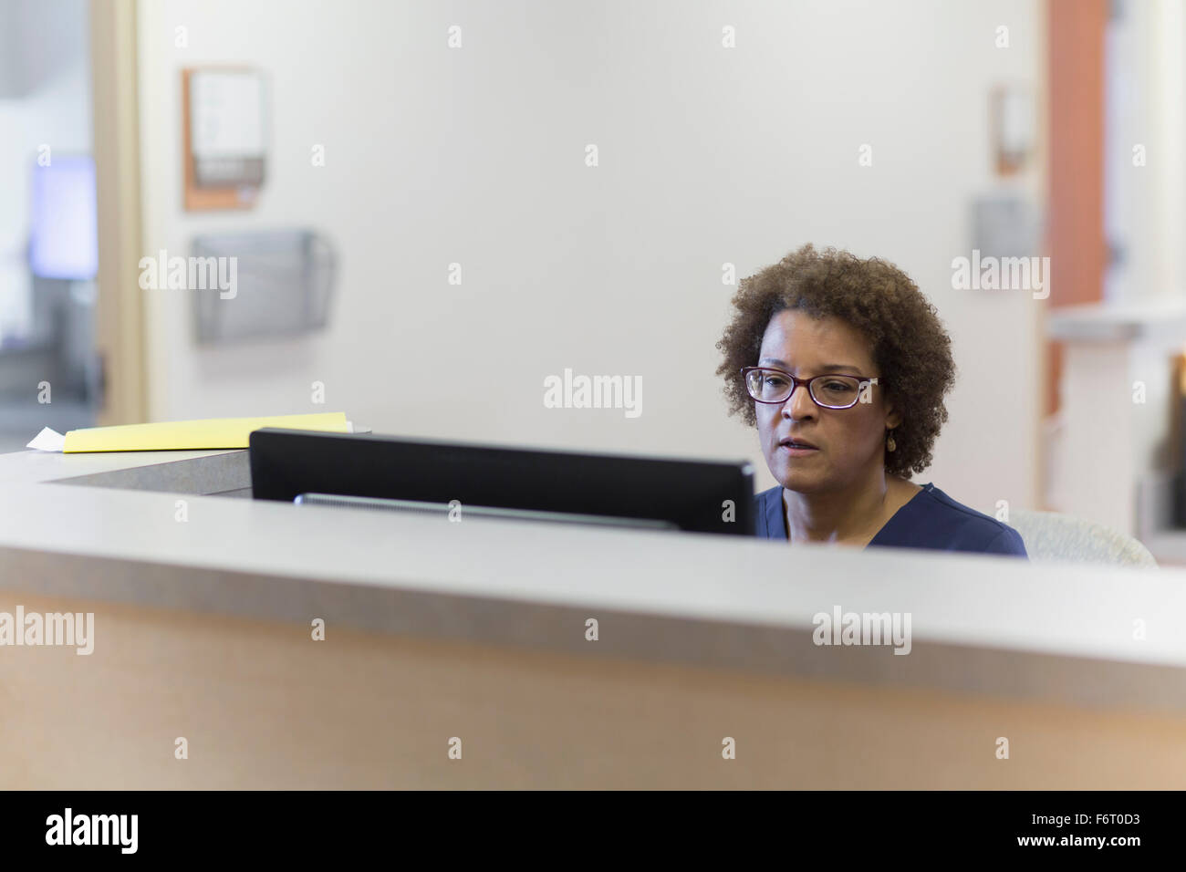 African American nurse using computer in hospital Stock Photo
