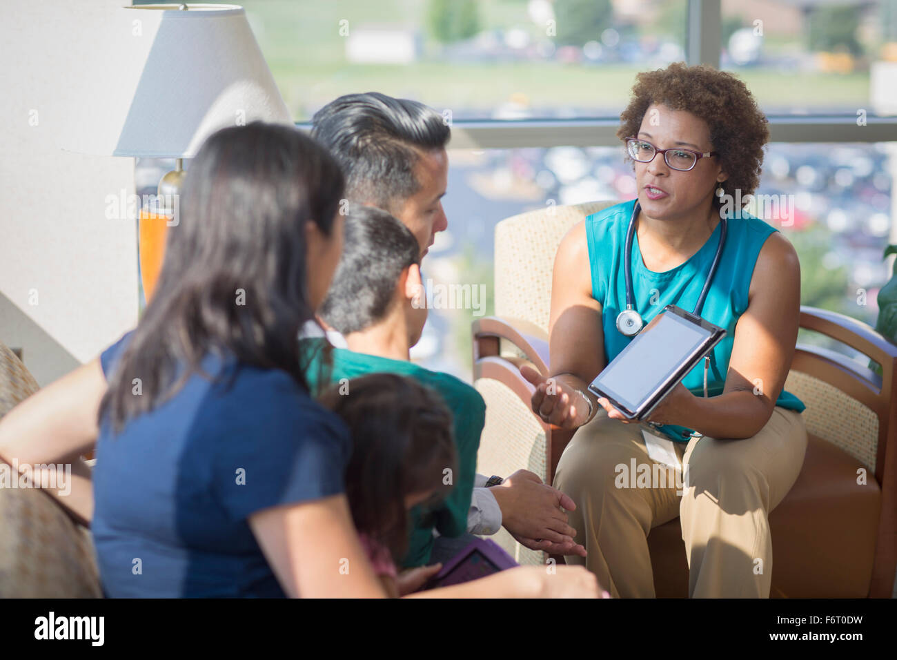 Doctor and patients using digital tablet Stock Photo