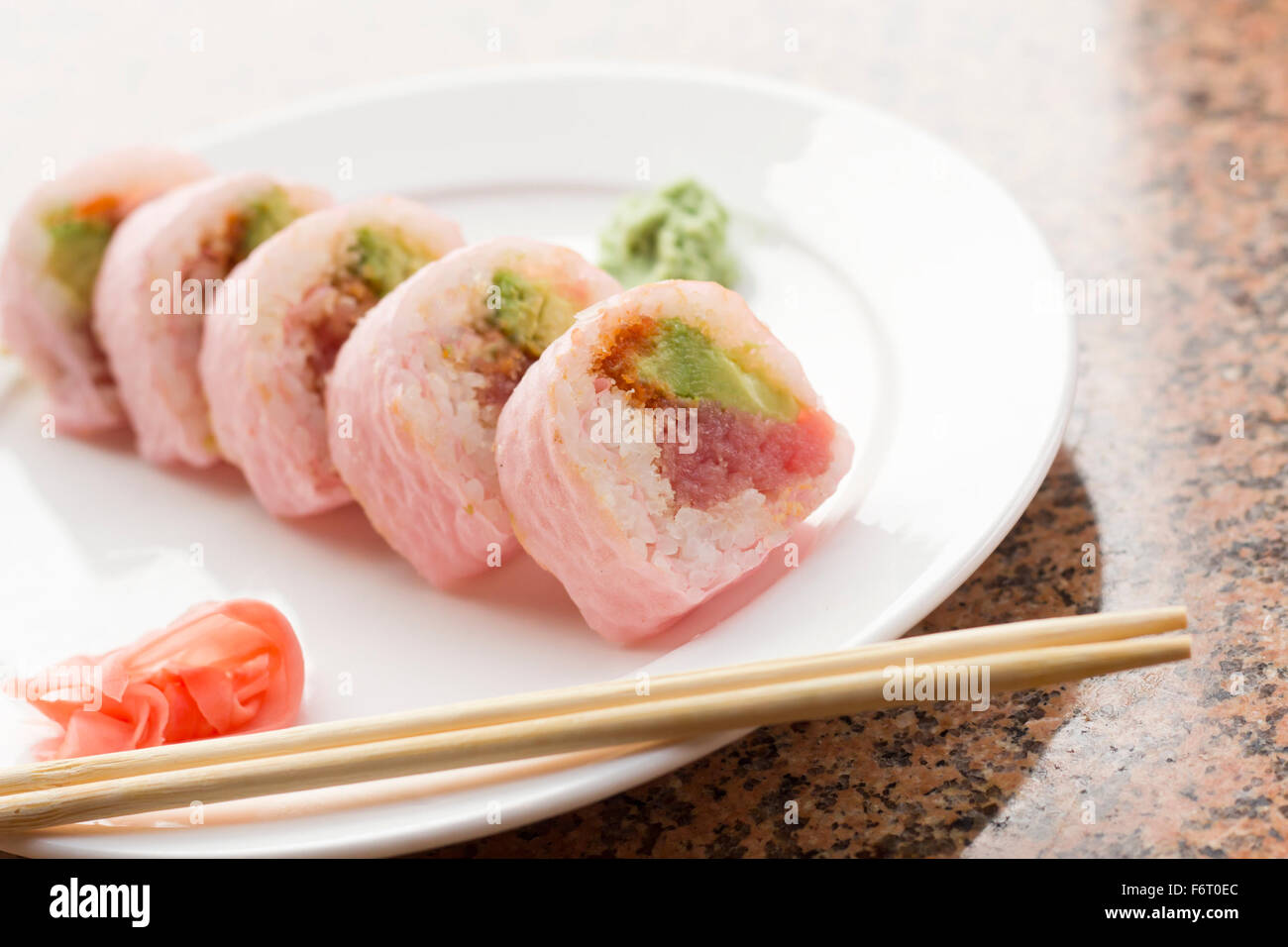Pink sushi wrap tuna avocado roll with wasabi and pickled ginger Stock  Photo - Alamy