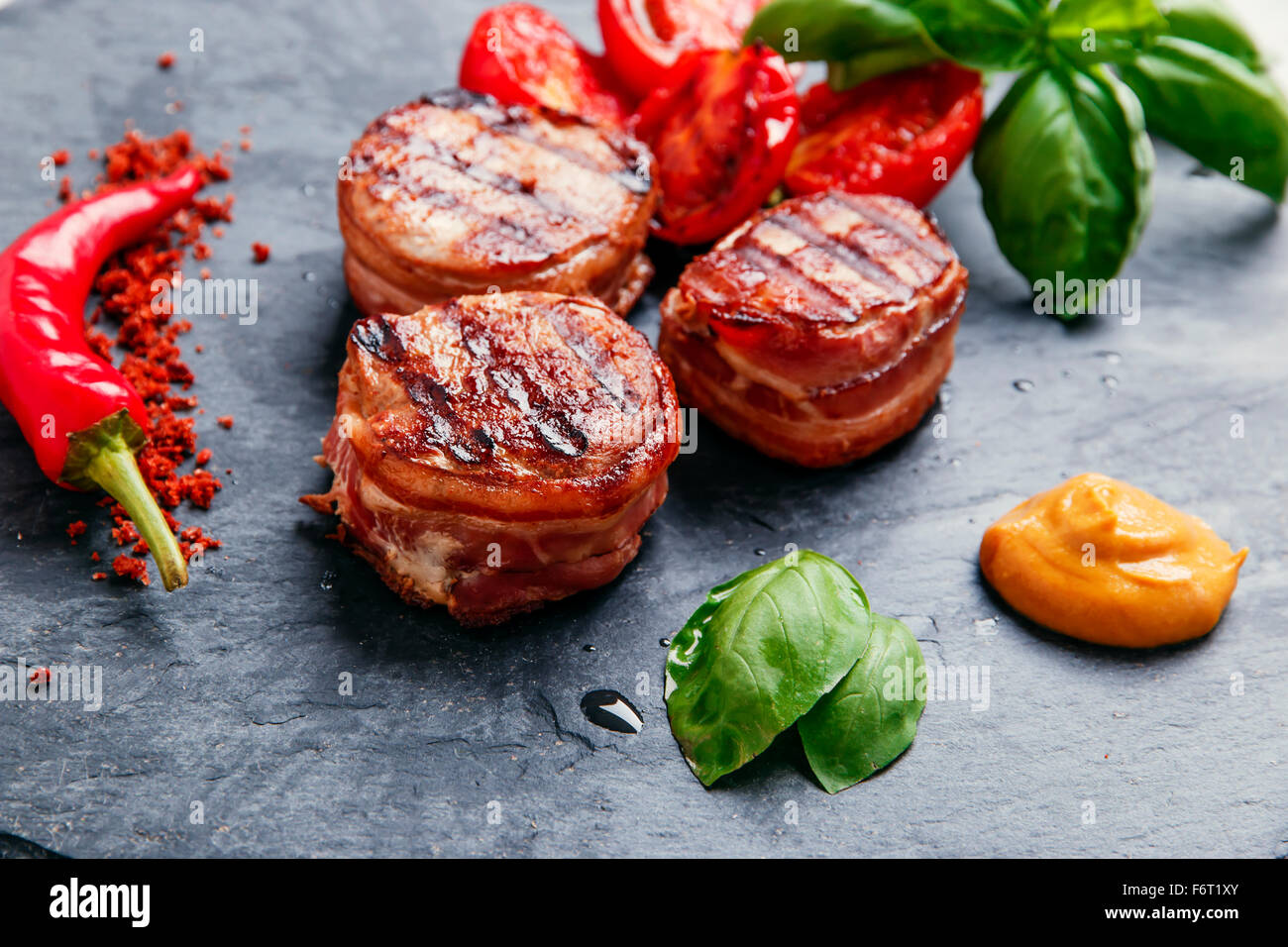 Grilled meat fillet steak wrapped in bacon medallions Stock Photo Alamy