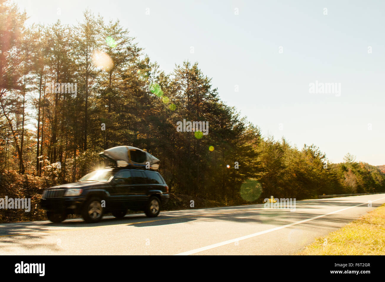 Car driving on rural road Stock Photo