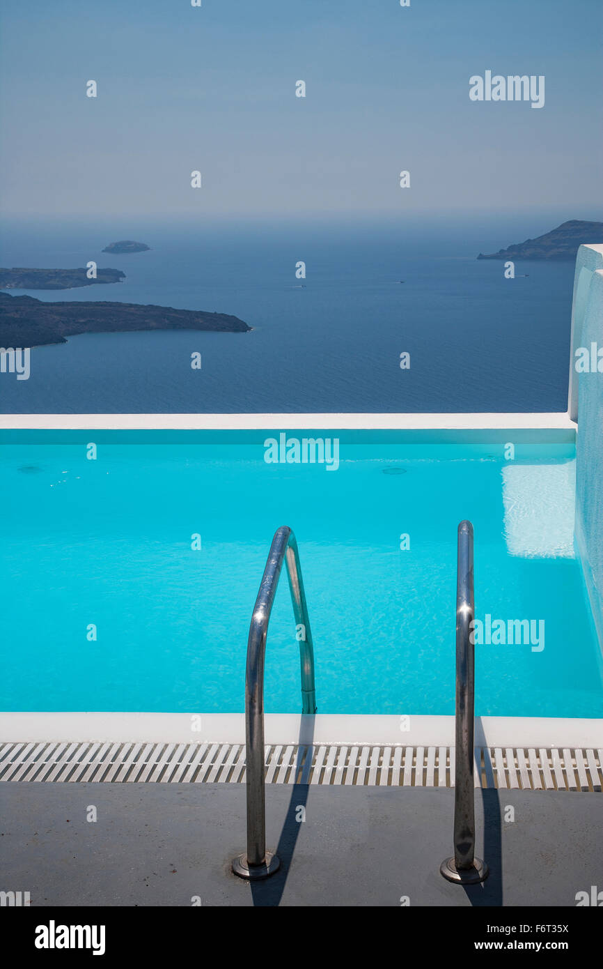 Swimming pool on hilltop over ocean Stock Photo