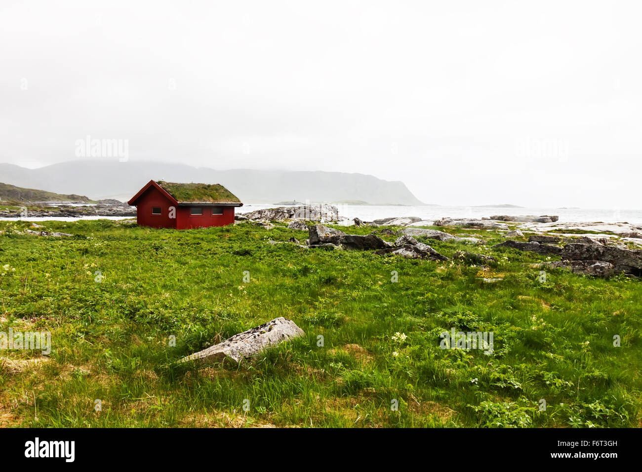 Typical red rorbu fishing hut in village , Lofoten Stock Photo