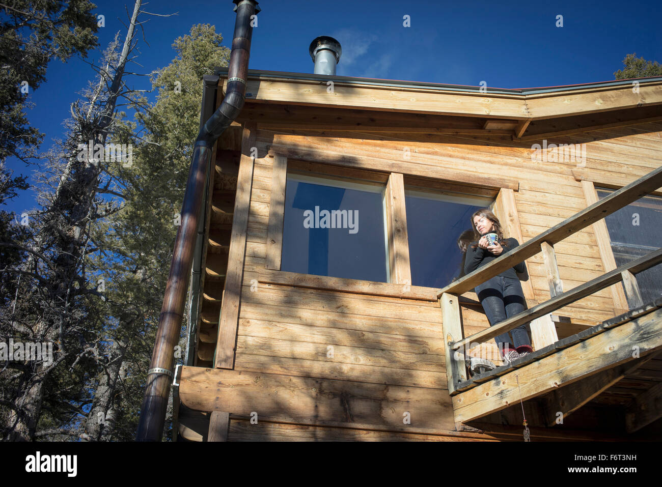 Caucasian woman standing on cabin deck Stock Photo