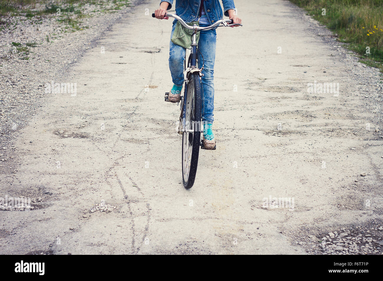 Caucasian teenage girl riding bicycle Stock Photo