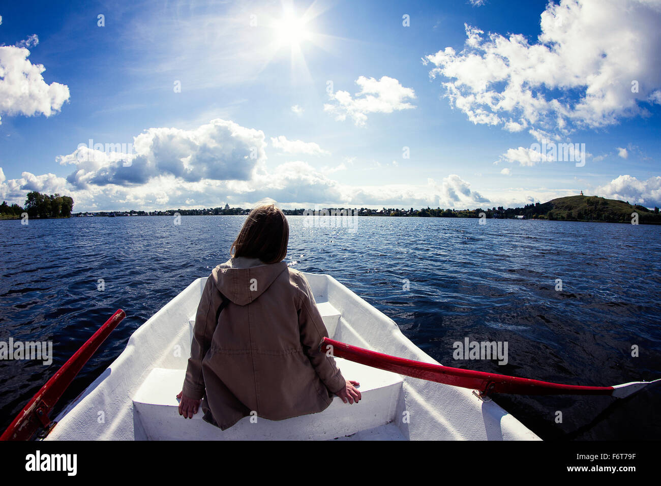 Caucasian woman sitting in rowboat Stock Photo