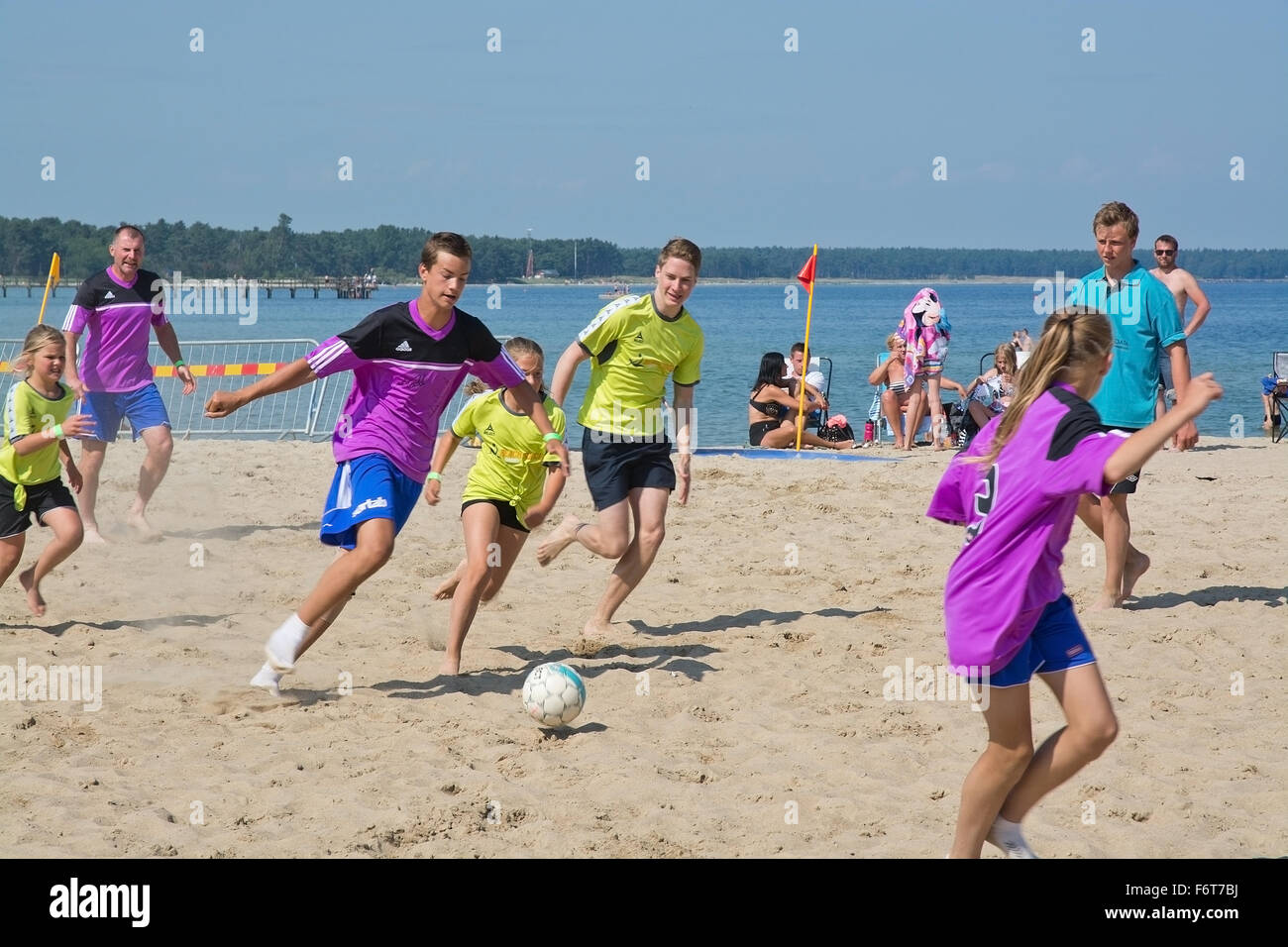 Beach soccer game in the yearly tournament at Tappet beach in Åhus Sweden in June 2014. Stock Photo