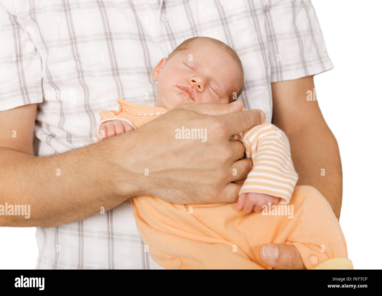 a sleeping baby lying on his father's arm, background white, isolated Stock Photo