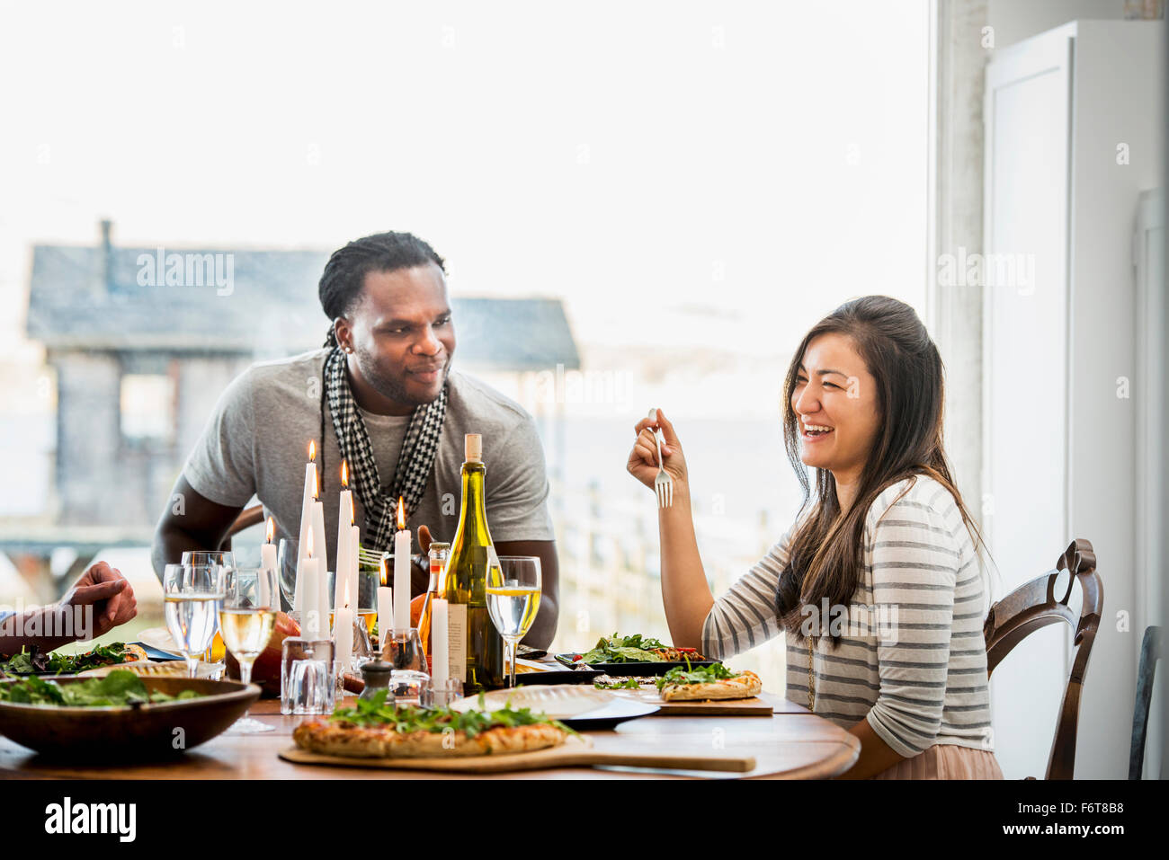 Couple talking at dinner party Stock Photo Alamy