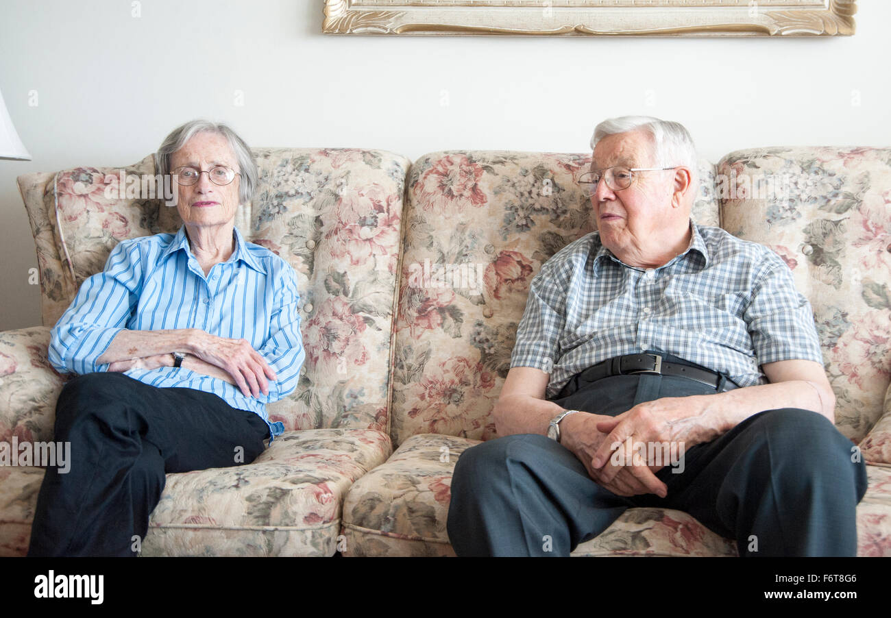 Couple sitting on couch man hi-res stock photography and images - Alamy