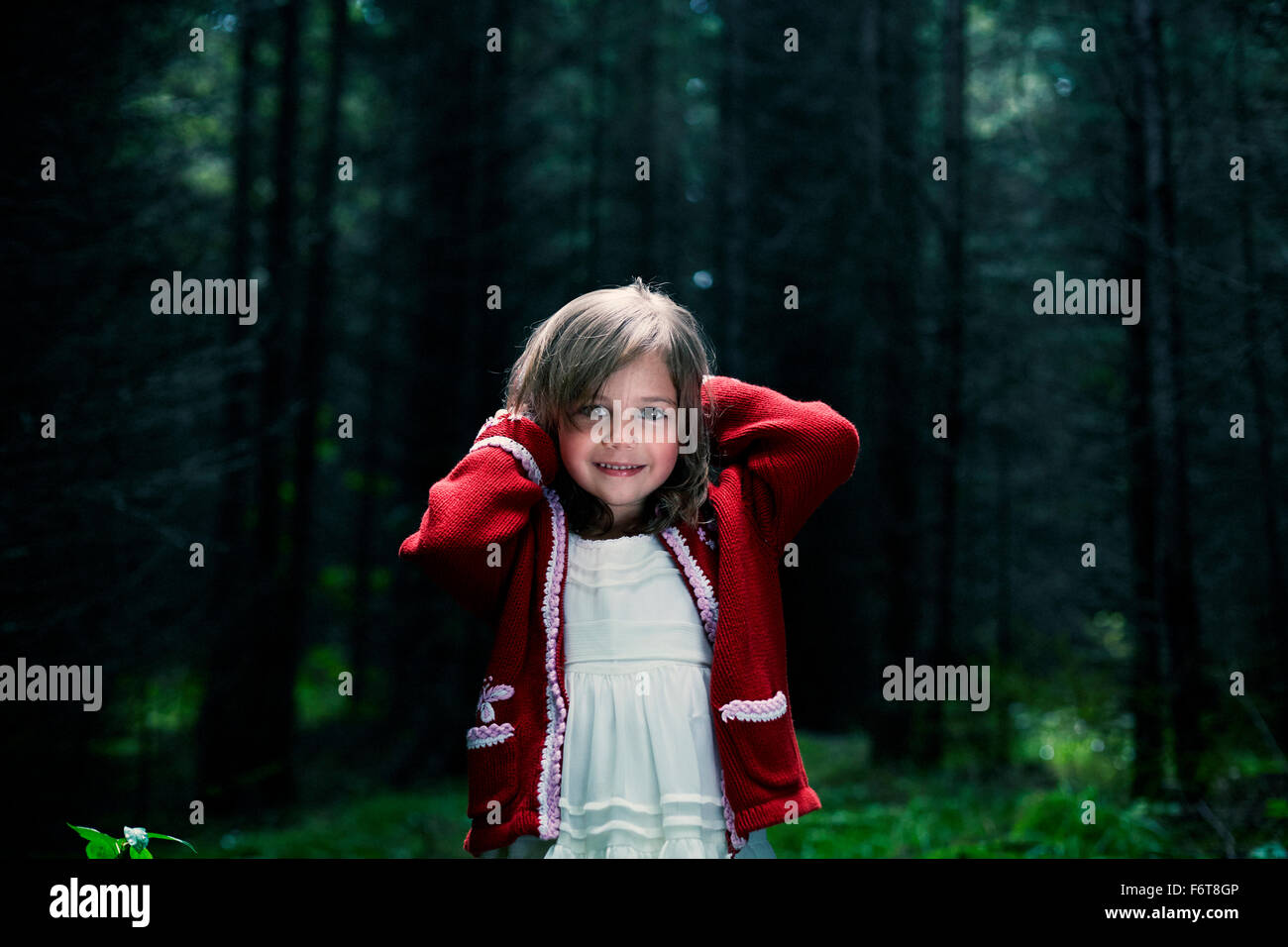 Caucasian girl smiling in forest Stock Photo - Alamy