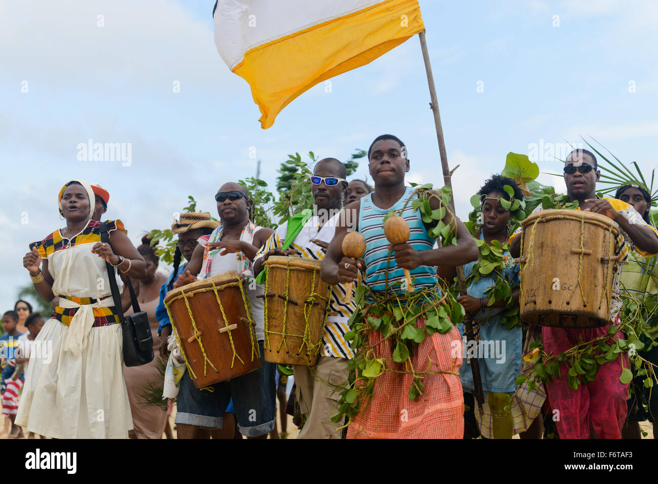 Hopkins Village, Belize, - November 19, 2015: The Garifuna people of Belize celebrate the landing of the first Garifuna people on the shores of Belize from Africa. This is a very important annual celebration for the Garifuna people and a time when they proudly show of their history and cultural heritage. Drummers and dancers lead a parade of celebration under the Belize flag. Credit:  Roi Brooks/Alamy Live News Stock Photo