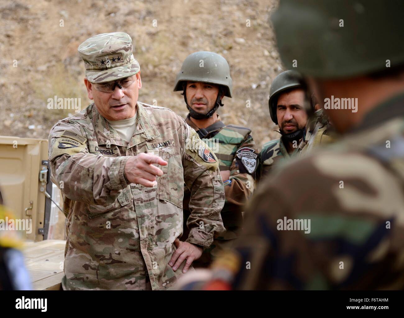 Kabul, Afghanistan. 19th November, 2015. Commander of U.S. Forces in Afghanistan Gen. John Campbell talks to Afghan National Army commandos after a training exercise demonstration at Camp Morehead November 19, 2015 in Kabul, Afghanistan. Stock Photo