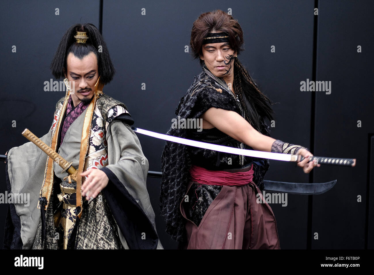 Photocall: The Japanese theatre company 30-DELUX present a samurai swordplay scene from their show KULI-KALA: REVENGE OF THE SAMURAI on 19/11/2015 at Crossrail Roof Gardens, Canary Wharf, London. Revenge of the Samurai is an action-packed tale of murder, revenge and magic featuring samurai swordplay, live music and song and a story of murder and revenge that opens at Stratford Circus on November 24th and runs till November 28th.. Picture by Julie Edwards Stock Photo