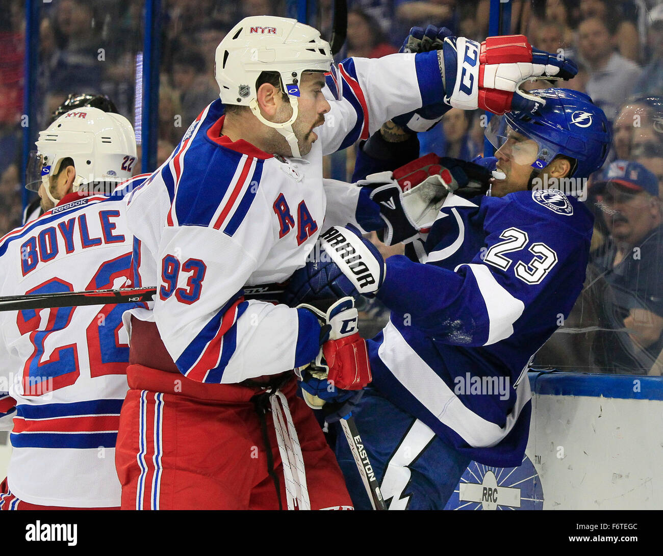 Tampa, Florida, USA. 19th Nov, 2015. DIRK SHADD | Times .Tampa Bay Lightning right wing J.T. Brown (23) gets roughed up by New York Rangers defenseman Keith Yandle (93) and defenseman Dan Boyle (22) during first period action at the Amalie Arena in Tampa Thursday evening (11/19/15). Boyle and Brown picked up roughing penalties on the play. © Dirk Shadd/Tampa Bay Times/ZUMA Wire/Alamy Live News Stock Photo