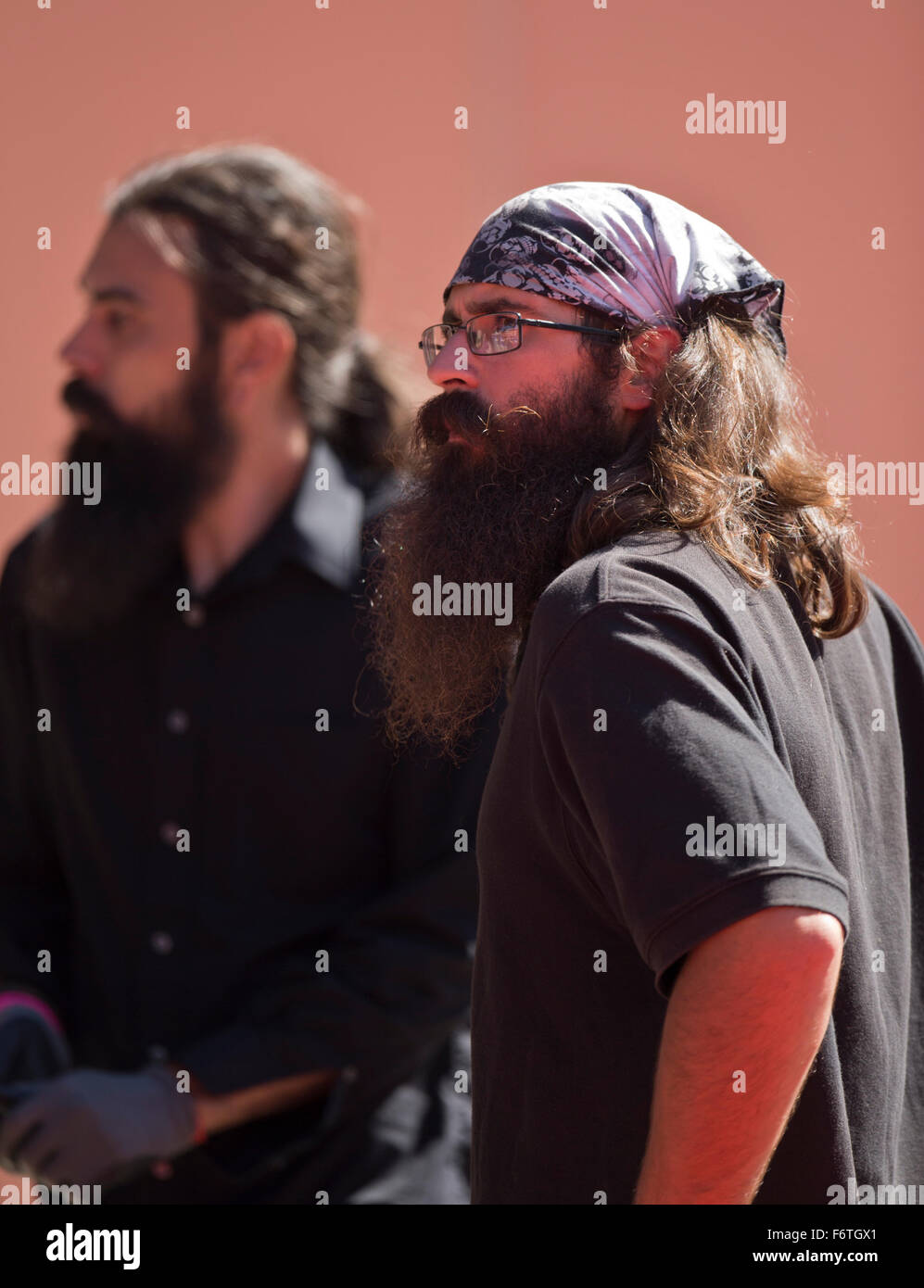 Long haired workers at a football game Stock Photo
