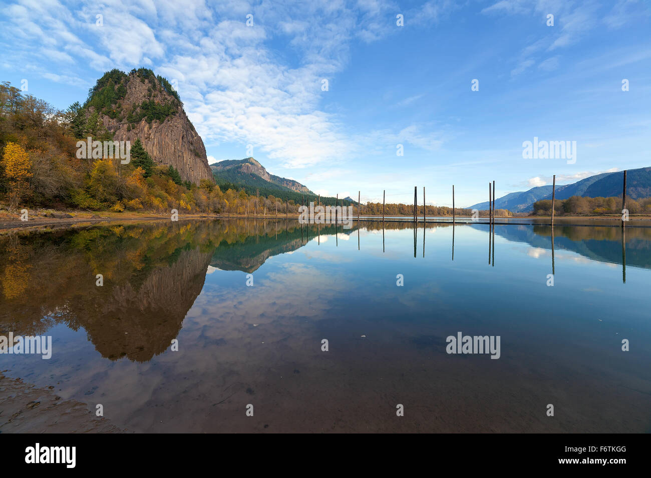 Beacon Rock State Park in Washington State Reflected in the Water of Columbia River Gorge in Fall Season Stock Photo