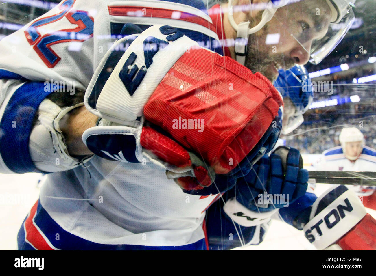 Tampa, Florida, USA. 19th Nov, 2015. Tampa Bay Lightning right wing Joel Vermin (47) checks New York Rangers defenseman Dan Boyle (22) into the glass during first period action at the Amalie Arena. Credit:  Dirk Shadd/Tampa Bay Times/ZUMA Wire/Alamy Live News Stock Photo