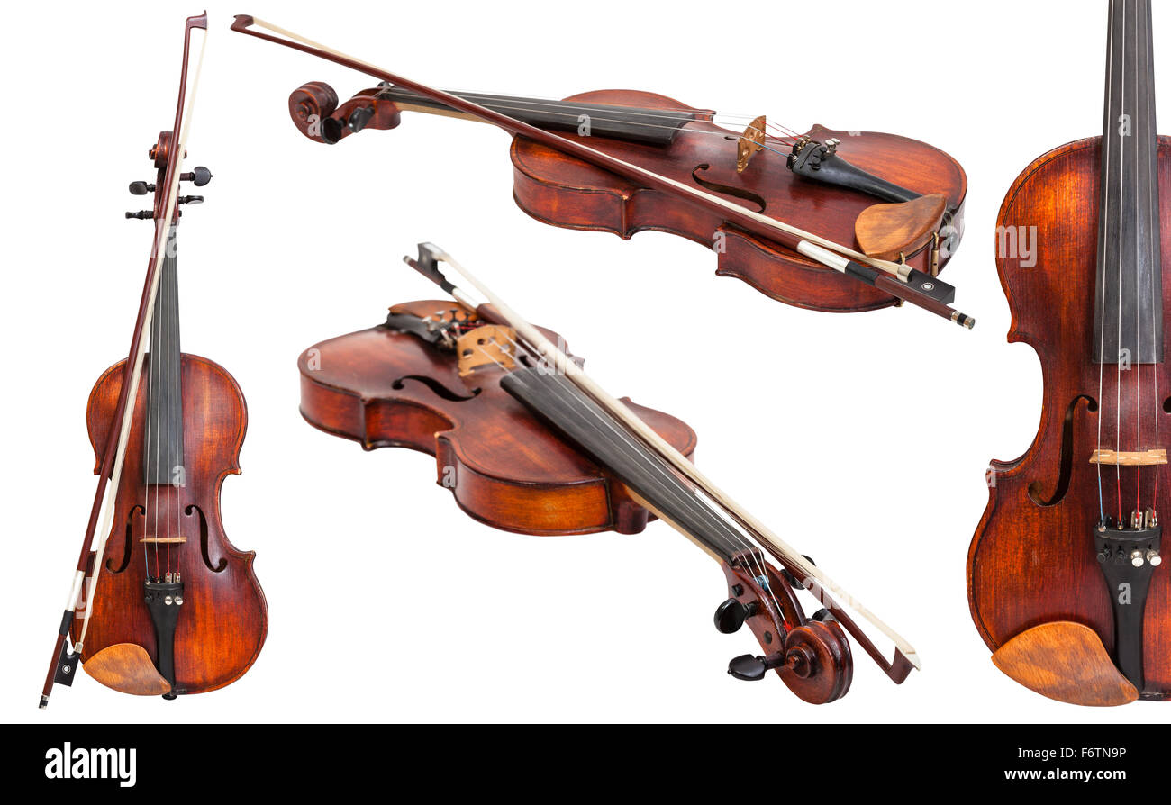 set of old violins with bows isolated on white background Stock Photo