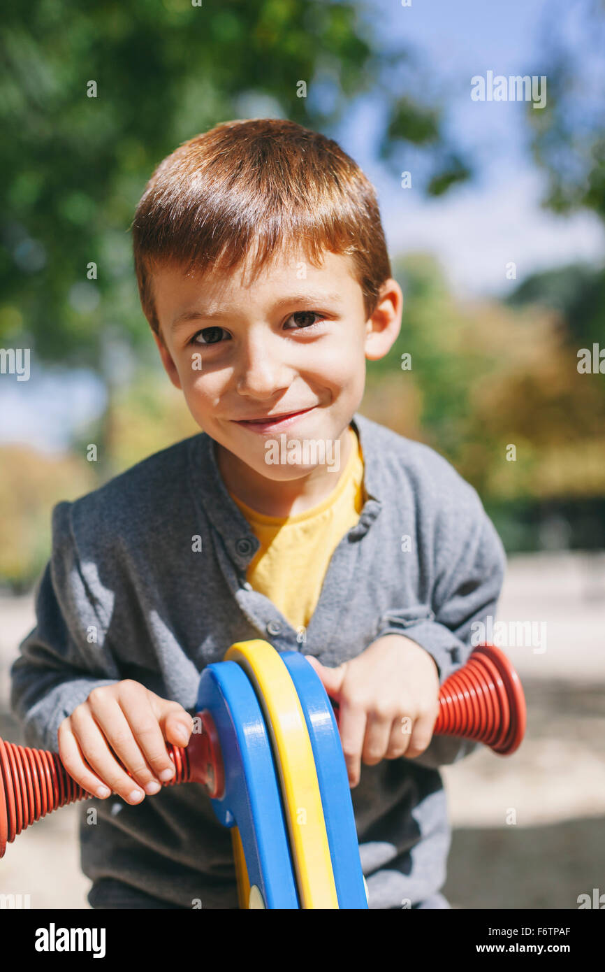 Portrait of smiling boy at the playground Stock Photo - Alamy