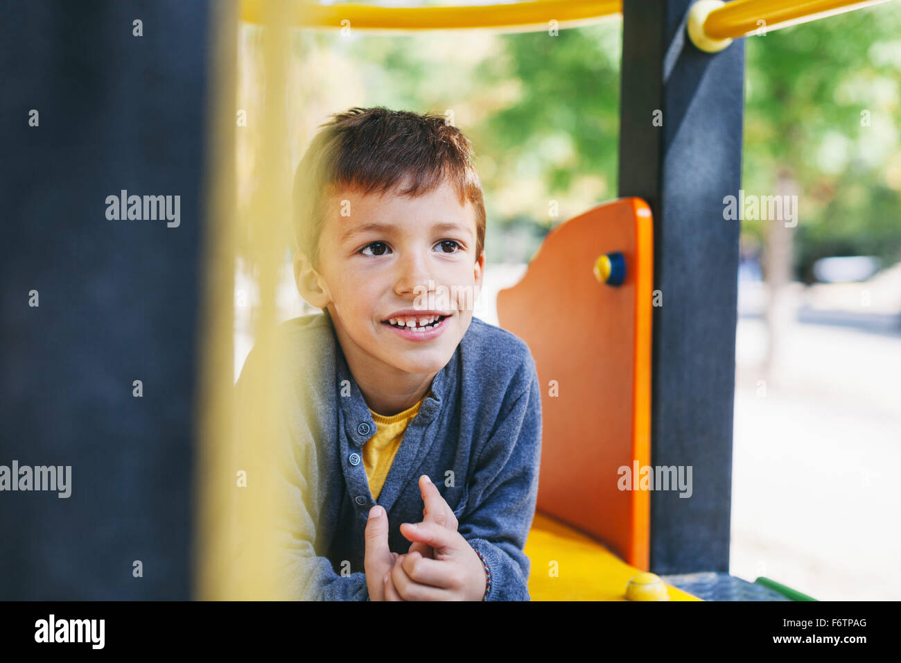 Smiling boy at the playground Stock Photo - Alamy