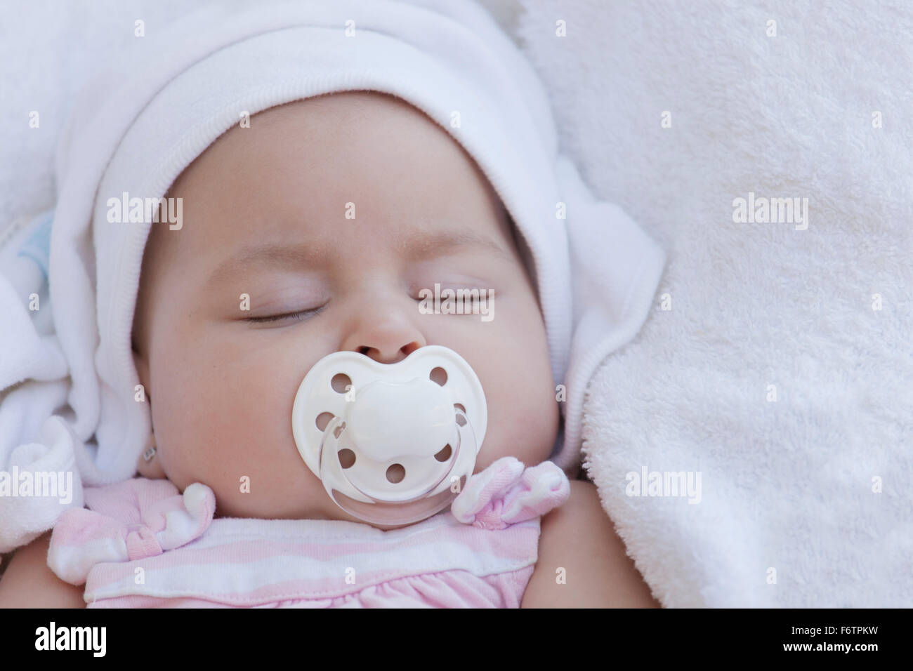 Portrait of sleeping baby girl with pacifier Stock Photo Alamy