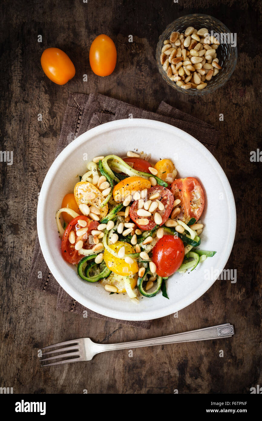 Helically coiled courgette, vegetable noodles, tomatoes in bowl Stock ...