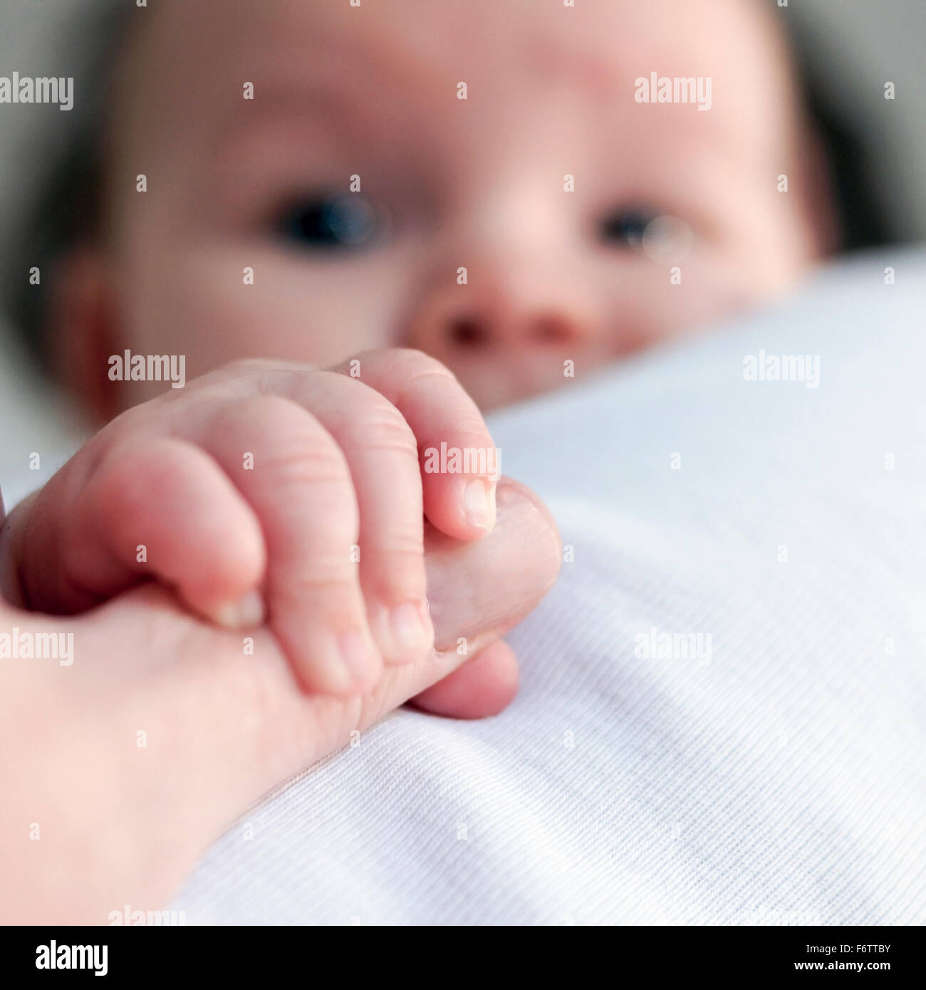 Adult Hand Reaching Baby Hand Stock Photos & Adult Hand Reaching Baby ...