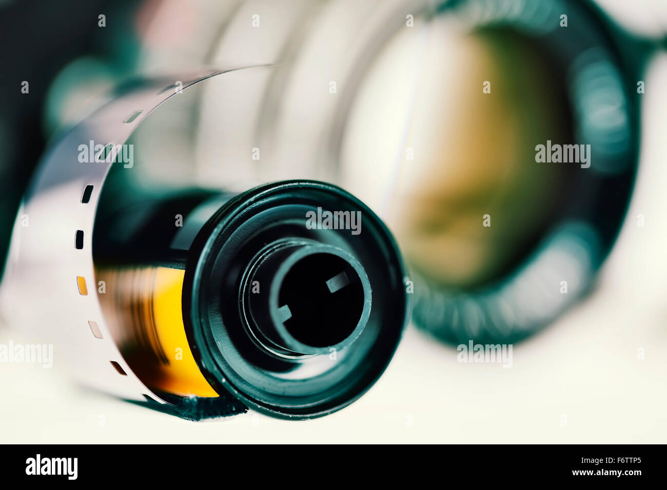 Negative film and lens in the background, closeup Stock Photo Alamy