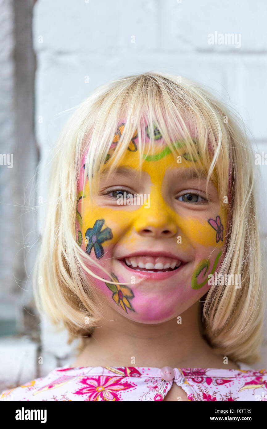 Portrait of smiling blond girl with painted face Stock Photo - Alamy