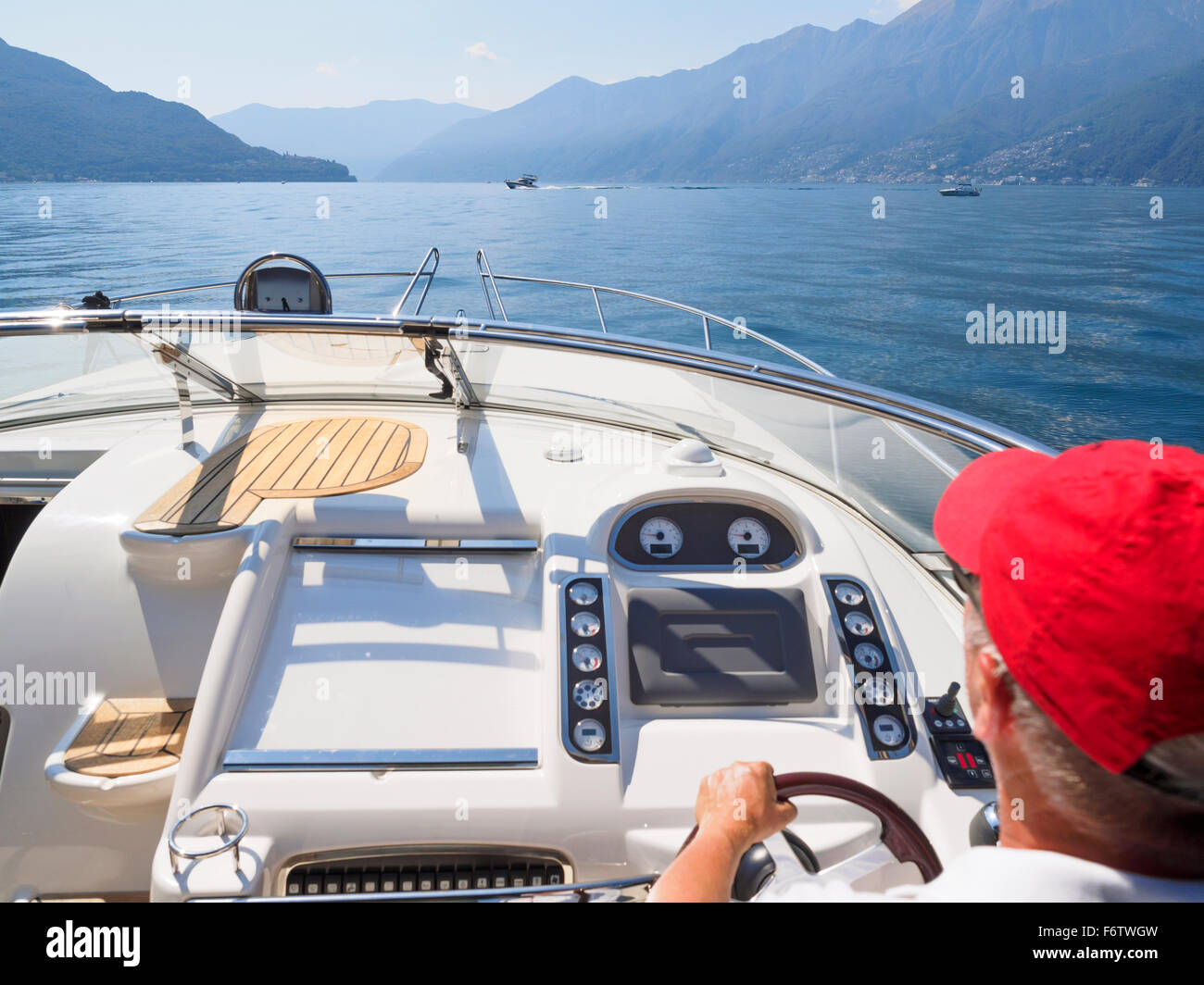 Switzerland, Ticino, Lago Maggiore, senior man on boat Stock Photo