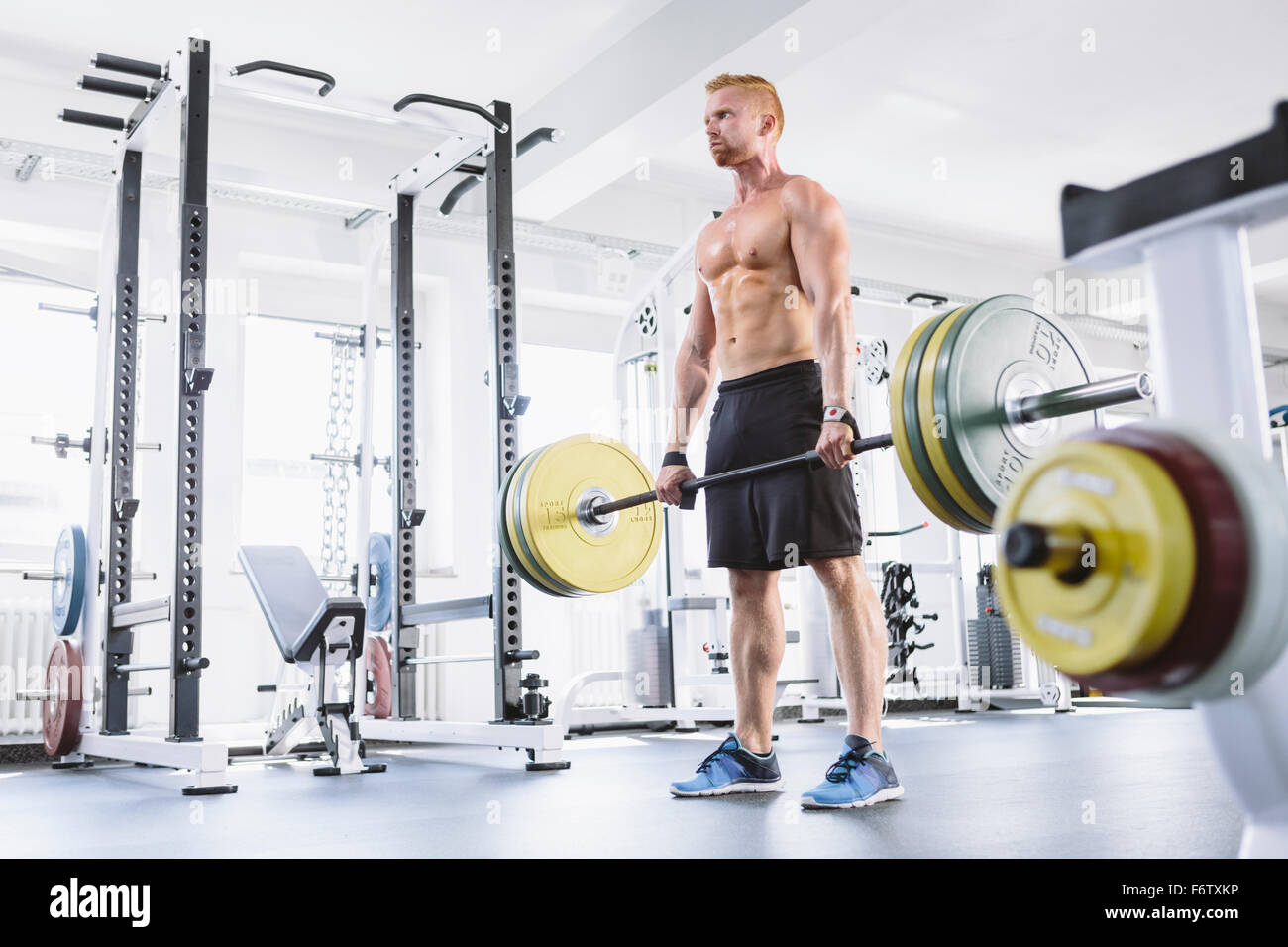 Physical athlete doing deadlifts Stock Photo