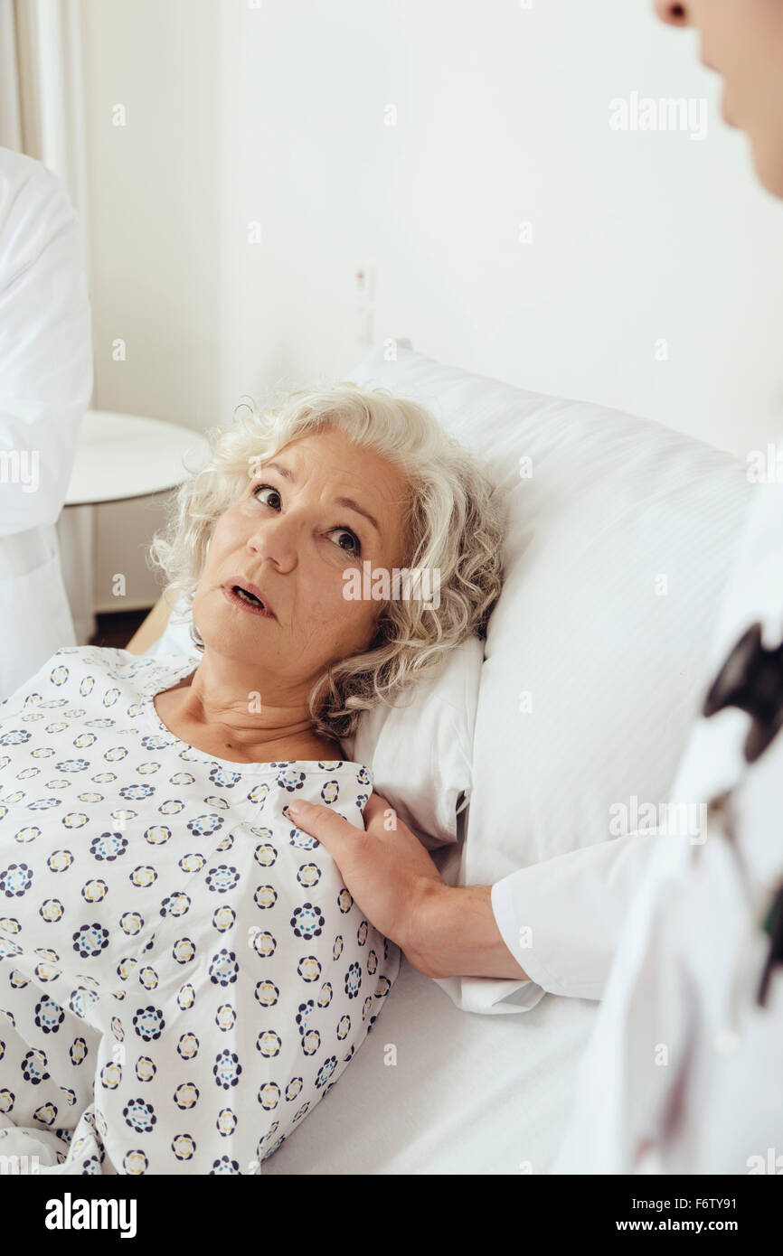 Woman hospital gown anxious hi-res stock photography and images - Alamy