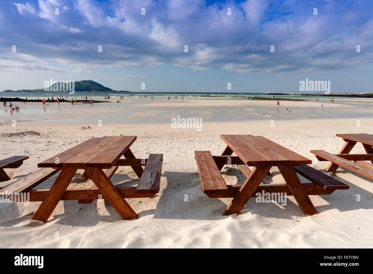 Empty wooden table on the beach, Jeju Island, South Korea Stock Photo