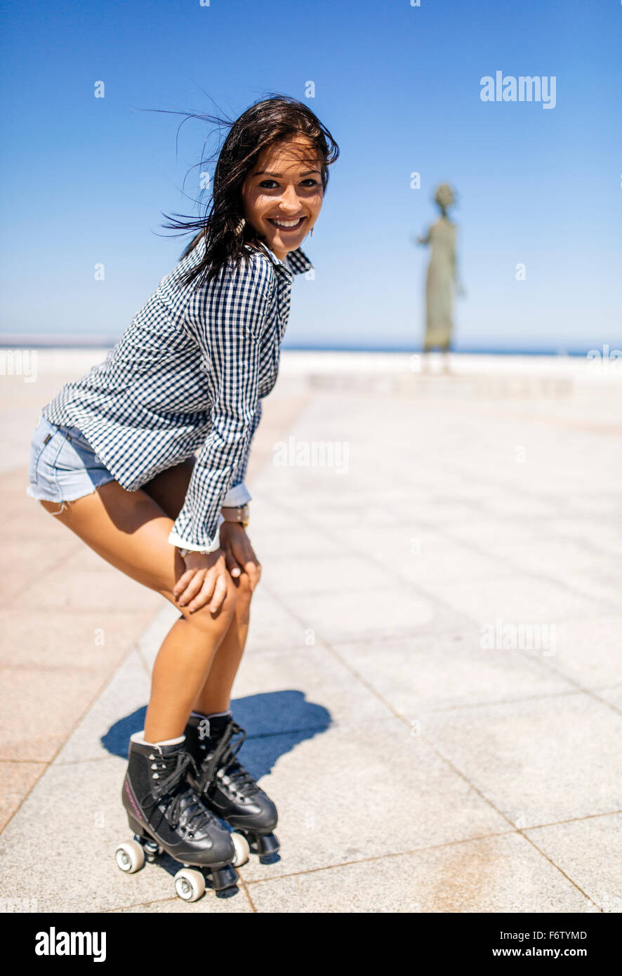 Spain, Gijon, smiling teenage girl on roller skates Stock Photo Alamy