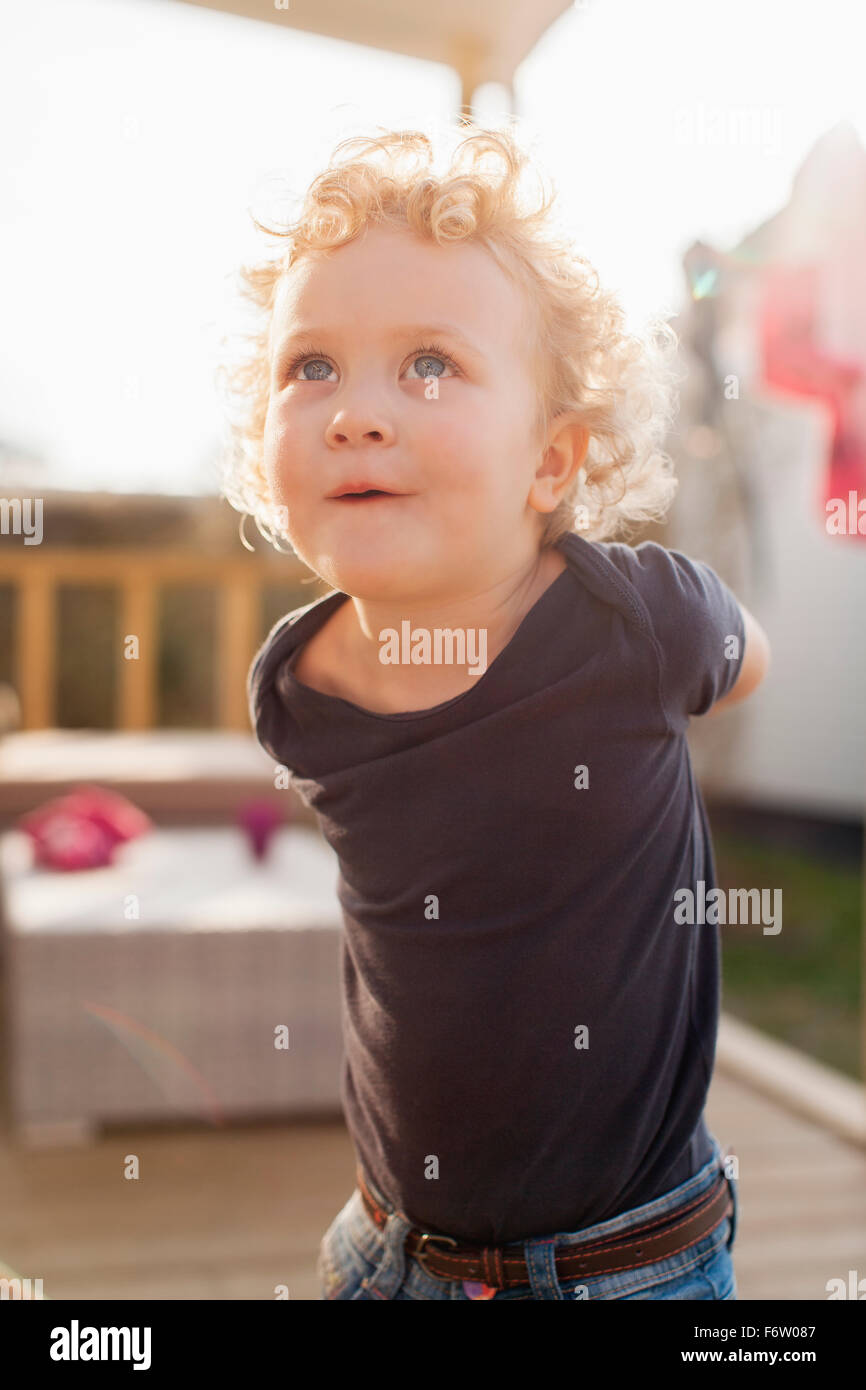 Little blond girl looking up Stock Photo - Alamy